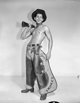 Chaps Prints: Shirtless Cowboy in Chaps with Rifle and Boots c.1959