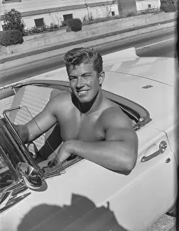 Muscular Prints: Shirtless Man Sitting in a Convertible c.1957