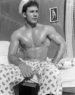Bodybuilder Prints: Shirtless Sailor in Pajamas in Bed c.1962