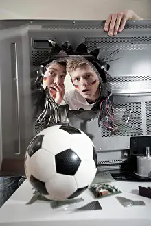 Astonished Prints: Two shocked teenage boys looking at soccer ball demolishing TV