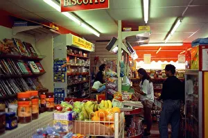 Customers Prints: Shops, Corner Shop, Staff Behind The Counter Of A Corner Grocery Shop In Brighton Serving Customers