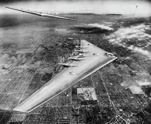Mode Of Transportation Prints: Shown here is an artist's conception of the Northrop Flying Wing XB-35 in flight over Los Angeles