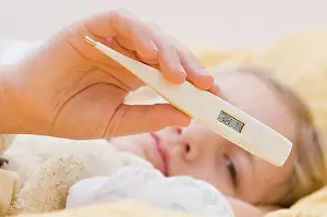 Measuring Prints: Sick girl with clinical thermometer in bed