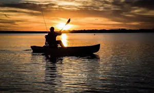 Sun Light Prints: silhouette of kayak fisherman