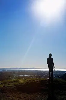 South Pacific Prints: Silhouette Of A Man In A Hat Standing On Mt. Eden With A View Of Auckland; New Zealand