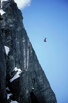Bold Prints: Ski-BASE jumper doing a front flip off a cliff near Lake Tahoe