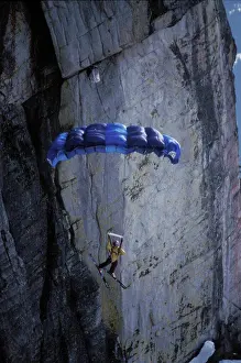 Bold Prints: Ski-BASE jumper doing a front flip off a cliff near Lake Tahoe