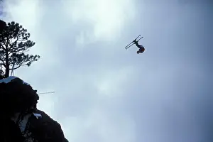 Bold Prints: Ski-BASE jumper doing a front flip off a cliff near Lake Tahoe