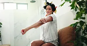 Perfect Prints: Skincare, bathroom and woman apply body cream for self care
