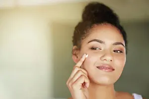 Cleaning Prints: Skincare, beauty and happy woman with cream in bathroom for dermatology
