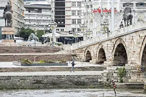 Symbolic Pictures Prints: Skopje, North Macedonia, view of the stone bridge (R) and Macedonia Square in Skopje