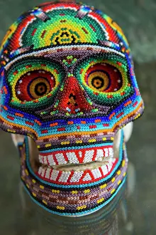 2018 Prints: A skull covered with glass beads on display in an art gallery in Oaxaca City, Mexico