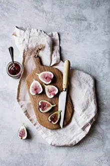 Knife Prints: Sliced fresh figs on a chopping board