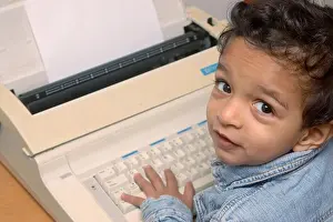 Expressions Prints: Small boy on electronic typewriter, MR # 468