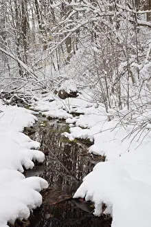 Small brook in Lincoln, New Hampshire USA after a snow storm