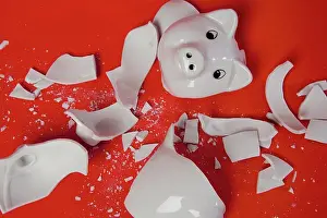 Colored Background Prints: A smashed empty piggy bank