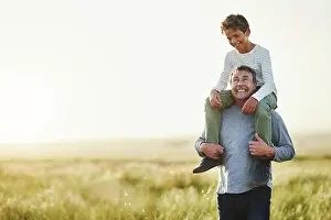 Fresh Air Prints: Smile, father and piggyback of son in nature