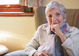 Elderly Prints: Smile, happy and portrait of senior woman sitting on sofa in the living room of retirement home