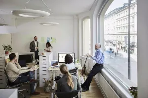 Organizing Prints: Smiling business professionals discussing in meeting at office