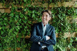 Upper Body Prints: Smiling businessman in green office