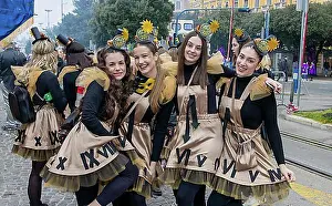 Joke Prints: Four smiling girls masked in clock dresses at the carnival in the city of Rijeka