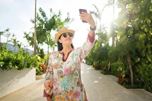 Journal Prints: Smiling woman takes a selfie in the backyard of her house