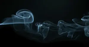 Dangerous Prints: Smoke of Cigarette rising against Black Background