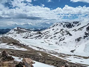 Unesco Prints: Snow-capped mountains and a frozen lake near Beartooth Pass