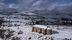 Minimalism Prints: Snow-covered church and cloudy sky in the Pyrenees
