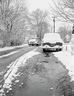 Roadway Prints: Snow-covered street and cars
