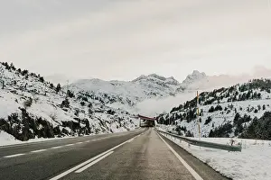 Route Prints: Snowy route running between mountains in Pyrenees