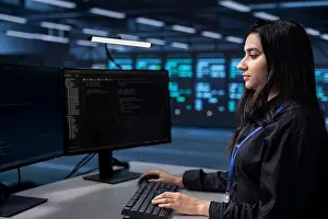 Big Data Prints: Software programmer in server farm tasked to oversee mainframes devices used for managing databases