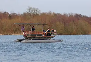 Tours Prints: Solar-powered electric boat with tourists on river
