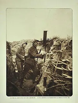 Flanders Prints: Soldier in trench checking with periscope where grenades strike in the battlefield at Diksmuide in Flanders during WWI
