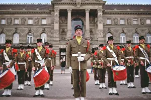 Uniform Cap Prints: Soldiers of The 153rd Infantry Regiment in uniforms with military band