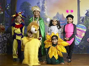 Expressions Prints: South Asian Indian boys and girls performing fancy dress competition on stage in nursery school MR