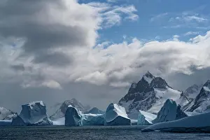 South Georgia Prints: South Georgia Island. sculpted blue icebergs floating in the Atlantic and mountain scenery