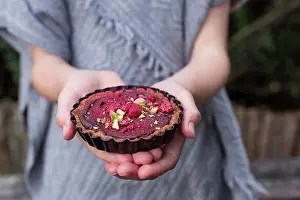 Ginger Prints: Spiced Chocolate Tarts being held in a girls hands