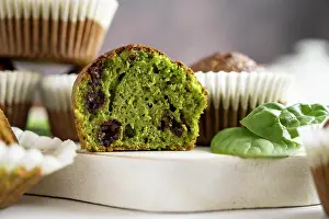 Flour Prints: Spinach muffins. Half of a green muffin with fresh spinach leaves. Home bakings