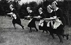 Trades Prints: Sports Carnival At Sudbury.Waitresses carrying plays during the 'Nippies' race
