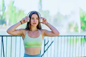 Cyberspace Prints: sporty woman listening to music from her headphones
