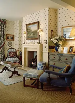 Stool Prints: Spotted neutral wallpaper in townhouse livingroom with floral firescreen in cream fireplace