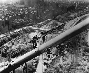 Scaffold Prints: Spring Cleaning -- Painters using an electrically operated scaffold