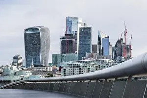 Battleship Prints: The Square Mile of London's financial district pictured over a curve around The Scoop on the London waterfront