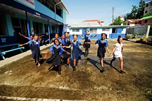 St Lucia, Canaries, cheerful schoolgirls running on a school ground (MR)