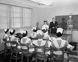 Blackboard Prints: Staff doctor delivering a lecture to nurses
