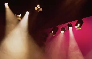 Shining Prints: Stage lights shining golden light with pink background