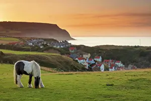 Seas Prints: Staithes fishing village and distant Boulby Cliffs on the North Yorkshire Heritage Coastline
