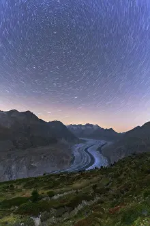Glacier Prints: Star trail in the night sky above Aletsch Glacier