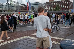 Gender Prints: Stockholm, Sweden A young couple kiss passionately at the Stockholm Pride march 2024 and a young couple kissing